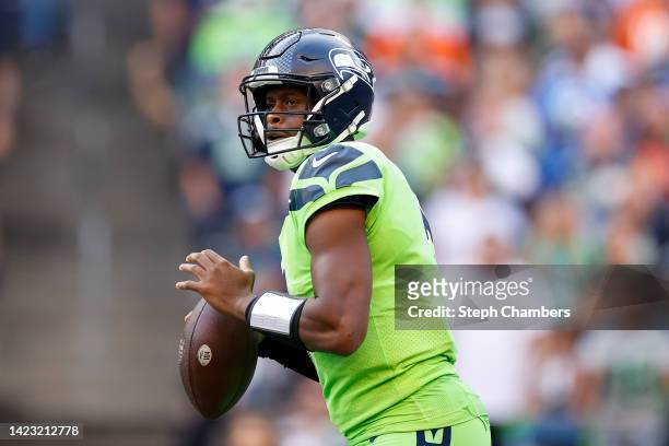 Geno Smith of the Seattle Seahawks drops back during the first quarter against the Denver Broncos at Lumen Field on September 12, 2022 in Seattle,...