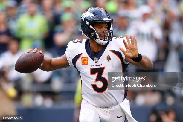 Russell Wilson of the Denver Broncos passes during the first quarter against the Seattle Seahawks at Lumen Field on September 12, 2022 in Seattle,...