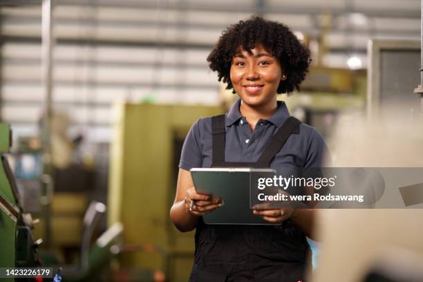 computer engineer woman portrait working in control room - mechanic portrait stock-fotos und bilder