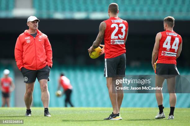 John Longmire, Senior Coach of the Swans talks to Lance Franklin of the Swans during a Sydney Swans AFL training session at Sydney Cricket Ground on...