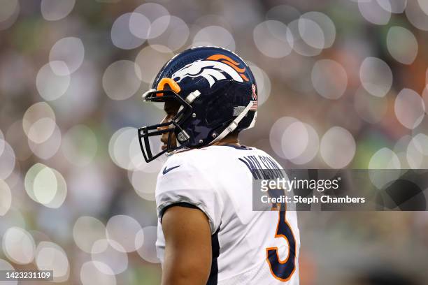Russell Wilson of the Denver Broncos looks on during the third quarter against the Seattle Seahawks at Lumen Field on September 12, 2022 in Seattle,...