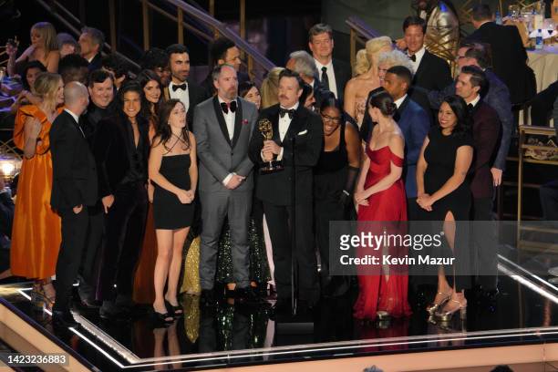 Jason Sudeikis and cast and crew of 'Ted Lasso' accept the Outstanding Comedy Series onstage during the 74th Primetime Emmys at Microsoft Theater on...