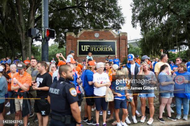 Fans wait outside the stadium for the Florida Gators to arrive for Gator walk before the start of a game against the Kentucky Wildcats at Ben Hill...