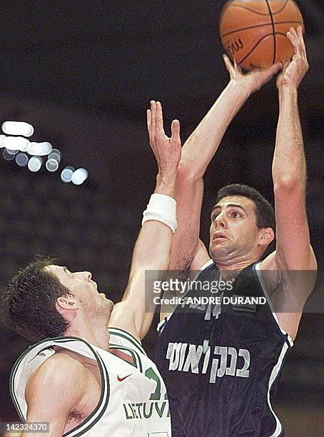 Israeli Tomer Steinhauer is challenged by Lithuania's Arturas Karnisovas during their European Championship match in Gerona 25 June.