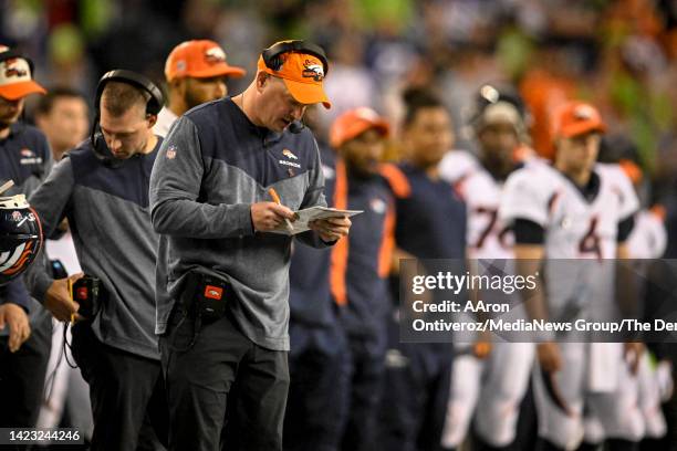 Head coach Nathaniel Hackett of the Denver Broncos works against the Seattle Seahawks during the second half of Seattles 17-16 win at Lumen Field on...