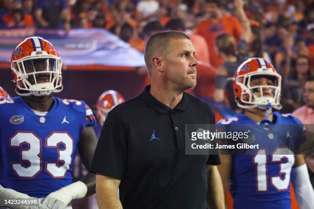 Head coach Billy Napier of the Florida Gators exits the locker room with his team before the start of a game against the Kentucky Wildcats at Ben...
