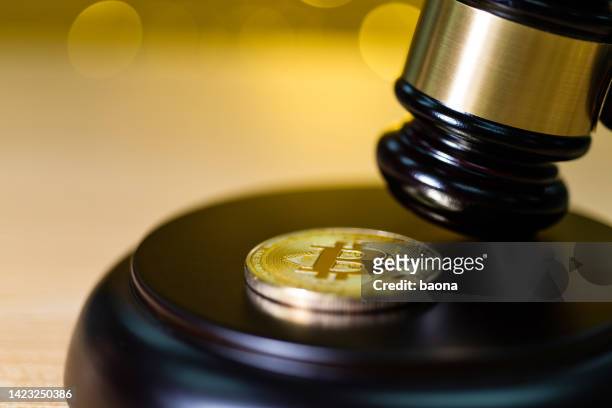 bitcoin coin on wooden gavel - china banking regulatory commission stock pictures, royalty-free photos & images