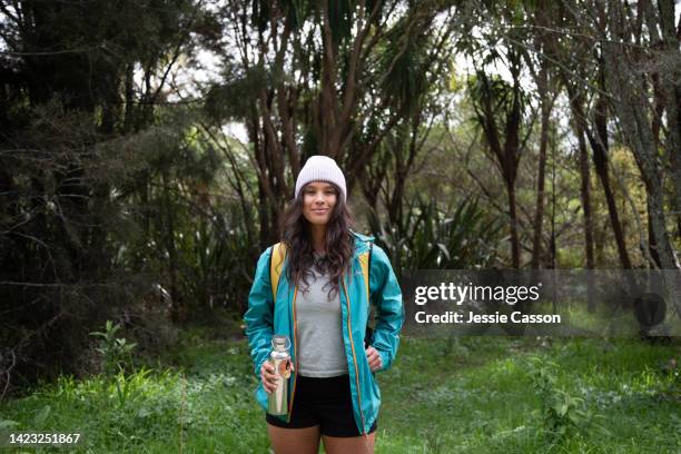 portrait of a woman hiking in nature - new zealand people stock pictures, royalty-free photos & images