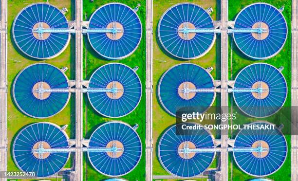 aerial view/a water treatment pond that treats water before it is used for consumption and consumption. - water treatment stock-fotos und bilder