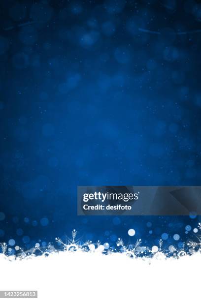 stockillustraties, clipart, cartoons en iconen met white colored border or frill of snow and ethereal shining christmas snowflakes at the bottom of a vibrant dark midnight blue vertical shining festive xmas backgrounds with bubbles like circles or dots - donkerblauw