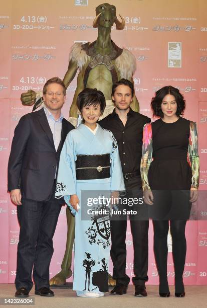 Director Andrew Stanton, singer Sachiko Kobayashi, actor Taylor Kitsch and actress Lynn Collins attend the 'John Carter' Press Conference at the Ritz...
