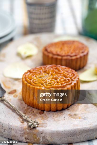 mooncakes on a marble chopping board - mooncake stock pictures, royalty-free photos & images