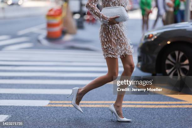 Leonie Hanne seen wearing a glitter dress with Balenciaga shades and shoes, outside PatBo Show during New York Fashion Week on September 10, 2022 in...