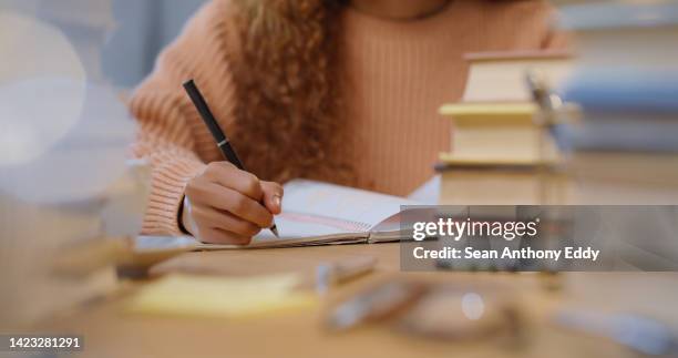 woman student study, writing and reading education book for an exam or test at school, college or university. academic girl studying and learning for knowledge while at a table with notes on paper - scholarship award stock pictures, royalty-free photos & images
