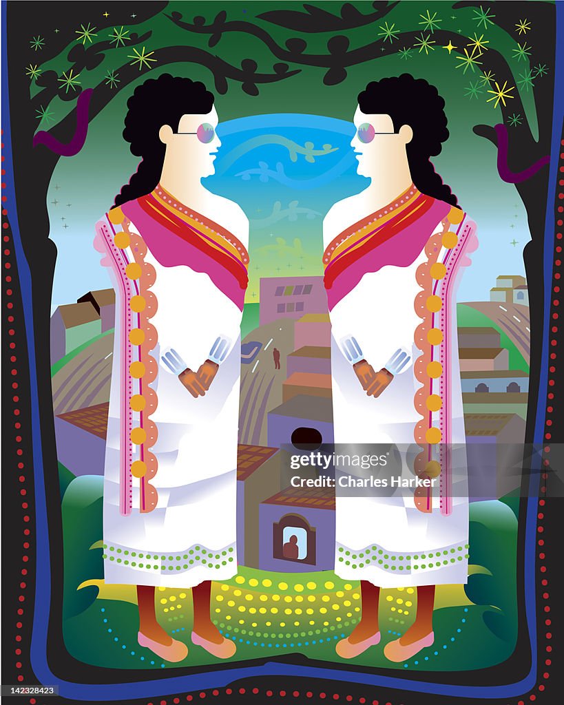 Two women in traditional dress in front of town