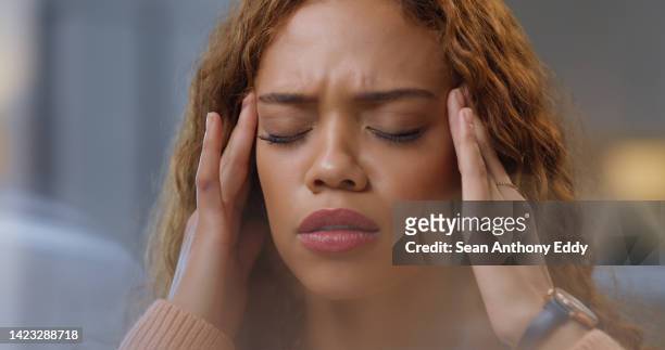 mental health, stress and woman with a headache in pain while working on business proposal email at office desk. burnout, fatigue and tired girl or person feeling migraine, worried and overwhelmed - good; times bad times stock pictures, royalty-free photos & images