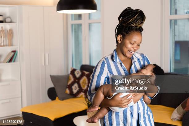 Mother Rocking Baby Photos and Premium High Res Pictures - Getty Images