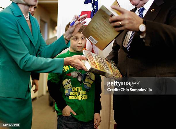 Ten-year-old James McKane of Frederick watchas as Republican Presidential candidate, former House Speaker Newt Gingrich and his wife Callista...