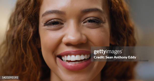 portrait of the face of a happy businesswoman smile and laughing while standing alone in an office at work. headshot of a confident and happy latin female advocate working at a legal company - african american and happy and close up and office stock pictures, royalty-free photos & images