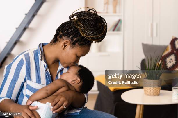 Mother Rocking 152 Mother Rocking Baby To Sleep Stock Photos, High-Res Pictures, and ...