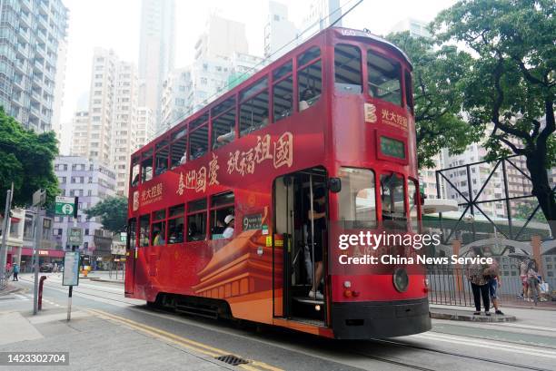 Tram with new paintings reading 'welcome China's National Day' runs along the street in Wan Chai District on September 12, 2022 in Hong Kong, China.