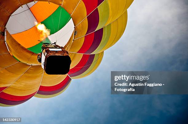 colourful hot air balloon - balloons stock-fotos und bilder