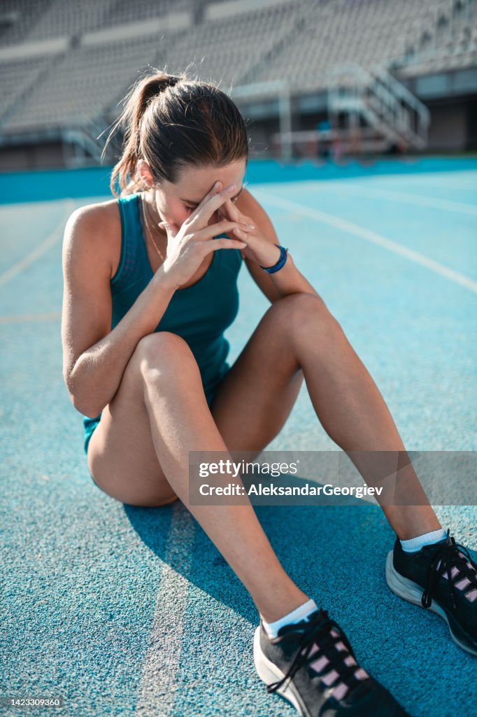 Distressed Running Stressed Female Athlete Dealing With Pain And Crying On Running Track ...