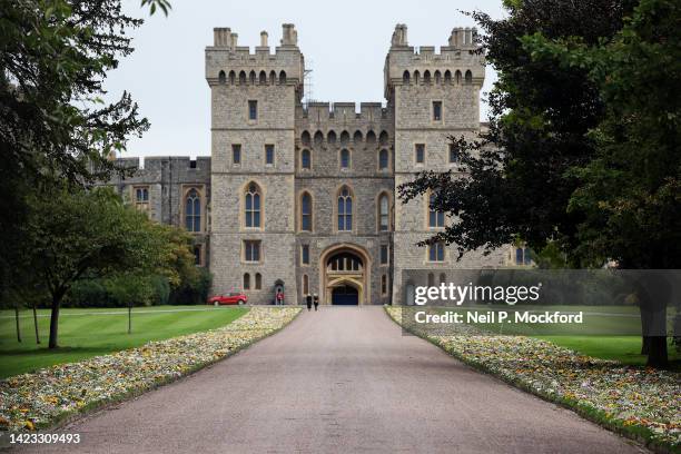 Flower tributes are moved to the grounds within the gates on The Long Walk, in front of Windsor Castle on September 13, 2022 in Windsor, England....