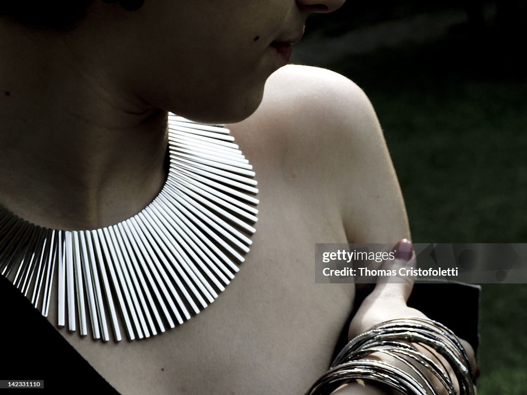 Girl wearing silver necklacee