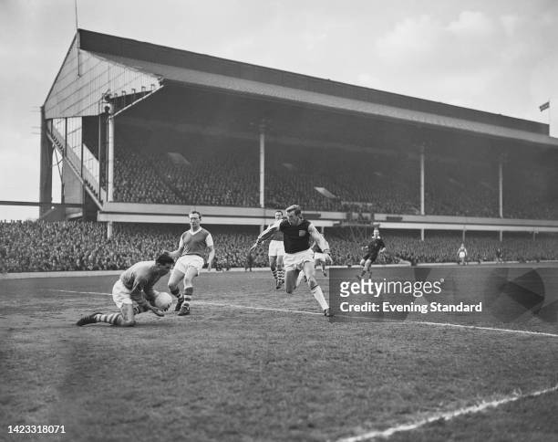 Soccer players in action during West Ham United vs Ipswich Town, League Division One match, at Upton Park stadium, London, UK, 24th February 1962.