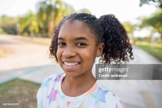 portrait of a smiling child looking at camera - children only laughing stock pictures, royalty-free photos & images