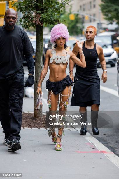 Collyns Rapper Rapper Coi Leray Collins wearing pink hat, top, black shorts, laced ...