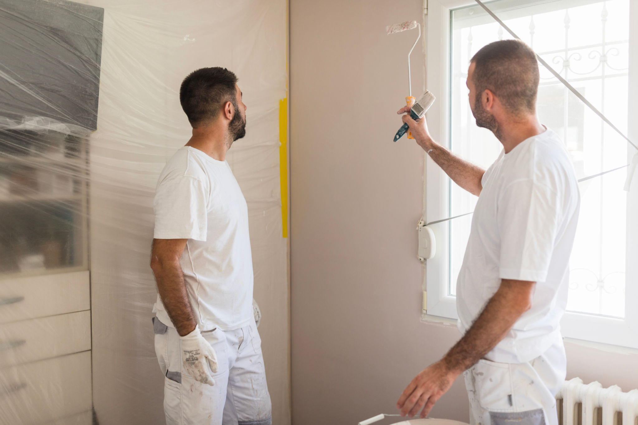 House painters discussing their work House painters discussing their work