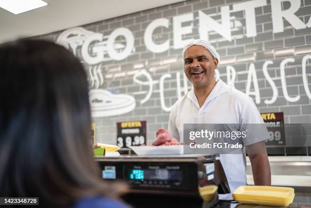 Butcher Helping Customer Photos and Premium High Res Pictures - Getty ...