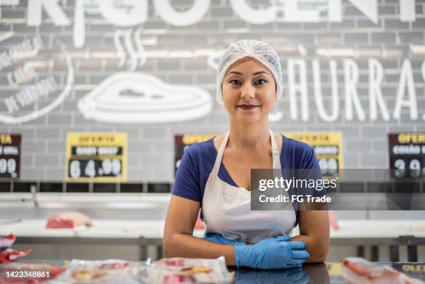 portrait of a butcher behind the counter - hair net stock pictures, royalty-free photos & images