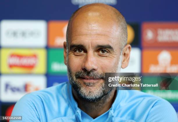 Pep Guardiola, Manager of Manchester City speaks during a press conference ahead of their UEFA Champions League group G match against Borussia...