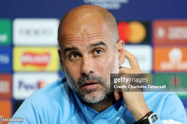 Pep Guardiola, Manager of Manchester City speaks during a press conference ahead of their UEFA Champions League group G match against Borussia...