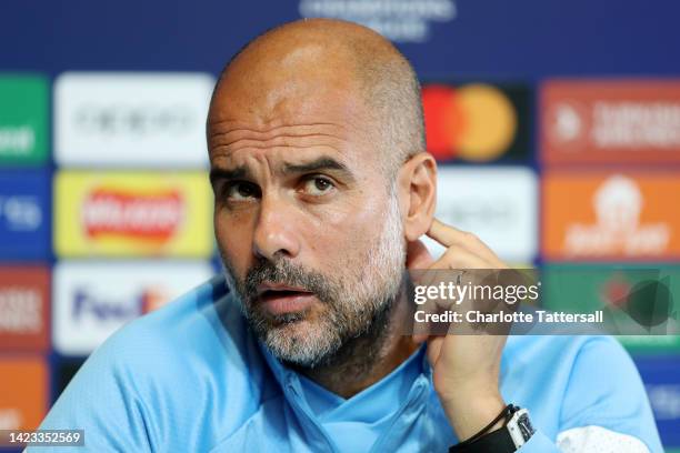 Pep Guardiola, Manager of Manchester City speaks during a press conference ahead of their UEFA Champions League group G match against Borussia...