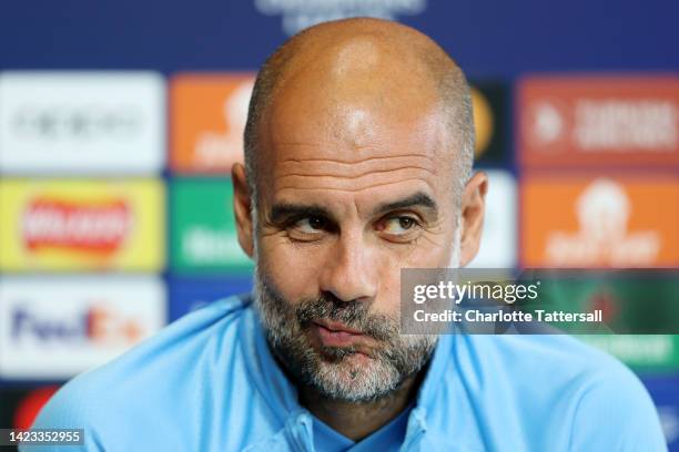 Pep Guardiola, Manager of Manchester City speaks during a press conference ahead of their UEFA Champions League group G match against Borussia...