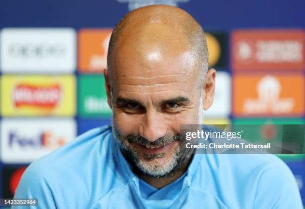 Pep Guardiola, Manager of Manchester City speaks during a press conference ahead of their UEFA Champions League group G match against Borussia...