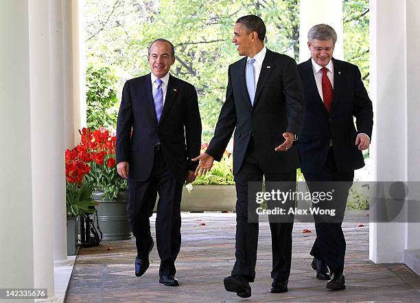 President Barack Obama , Canadian Prime Minister Stephen Harper , and Mexican President Felipe Calderon come out from the Oval Office for a joint...