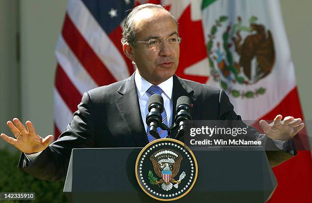 Mexican President Felipe Calderon answers a question during a joint press conference with U.S. President Barack Obama and Canadian Prime Minister...