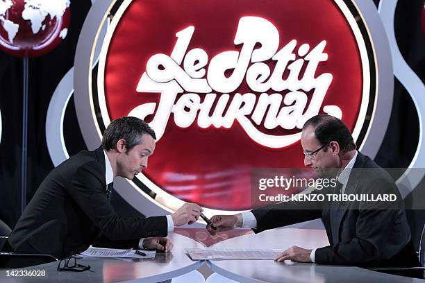 France's opposition Socialist Party candidate for the 2012 French presidential election Francois Hollande takes part in the TV show "Le petit...