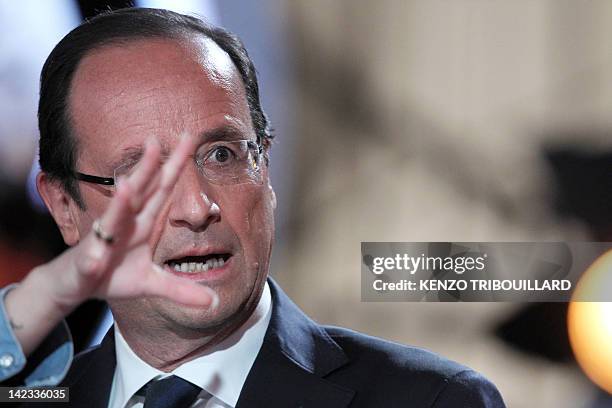 France's opposition Socialist Party candidate for the 2012 French presidential election Francois Hollande takes part in the TV show "Le petit...