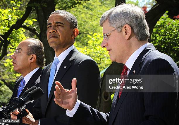 President Barack Obama , Canadian Prime Minister Stephen Harper , and Mexican President Felipe Calderon participate in a joint press conference in...