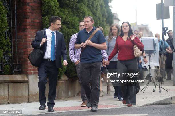 Families of Sandy Hook Elementary School shooting victims walk into Waterbury Superior Court with their lead lawyer Josh Koskoff at the start of the...