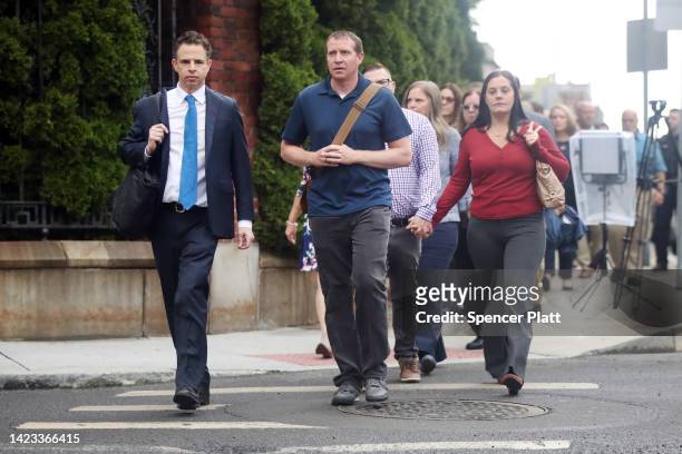 Families of Sandy Hook Elementary School shooting victims walk into Waterbury Superior Court with their lead lawyer Josh Koskoff at the start of the...