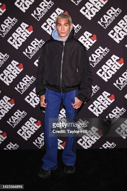 Evan Mock attends a celebration of the "Cara Loves Karl" capsule collection at Saga on September 12, 2022 in New York City.