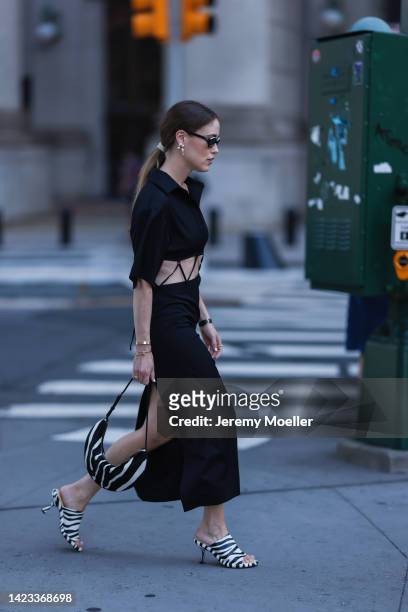 Annabel Rosendahl seen wearing chanel shades, black dress with animal print bag and shoes, outside PatBo Show during New York Fashion Week on...