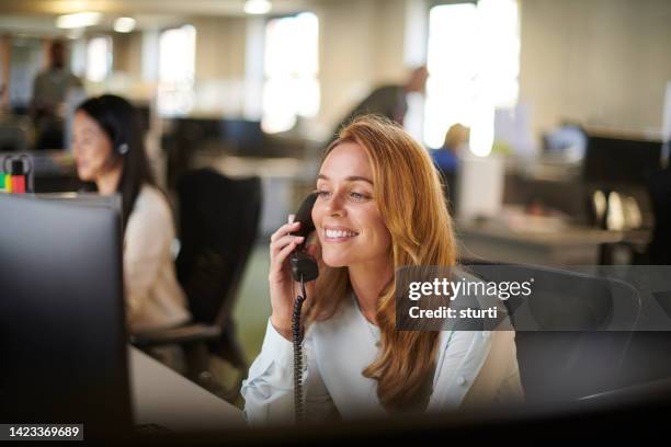 office phone call - answering stock pictures, royalty-free photos & images